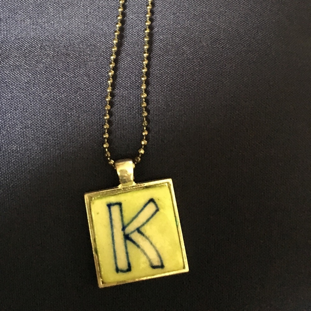 Pendant personalized with letter “K”